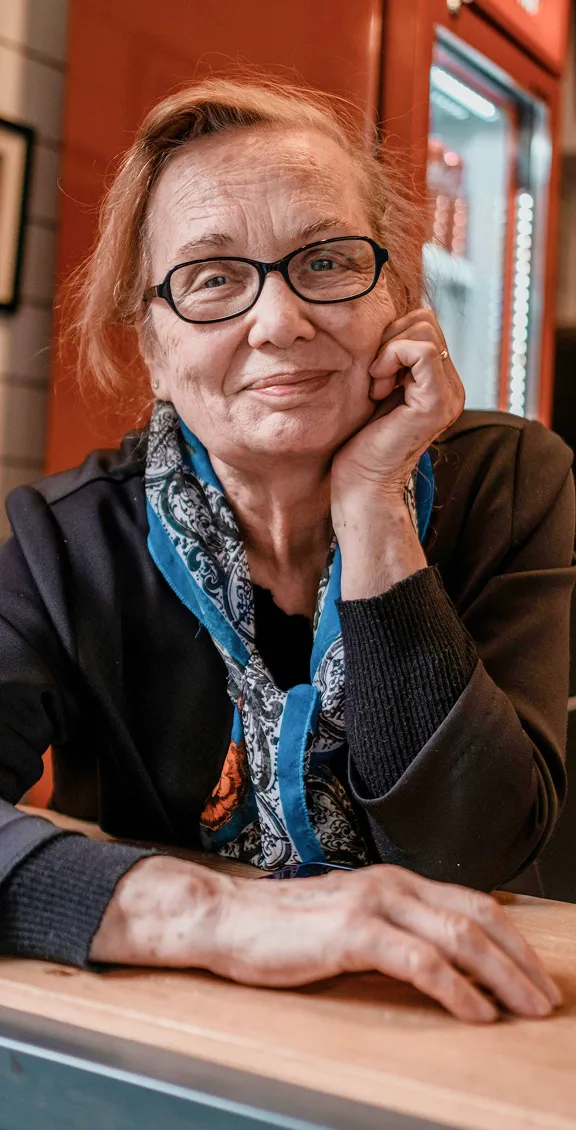 A senior smiling at the camera