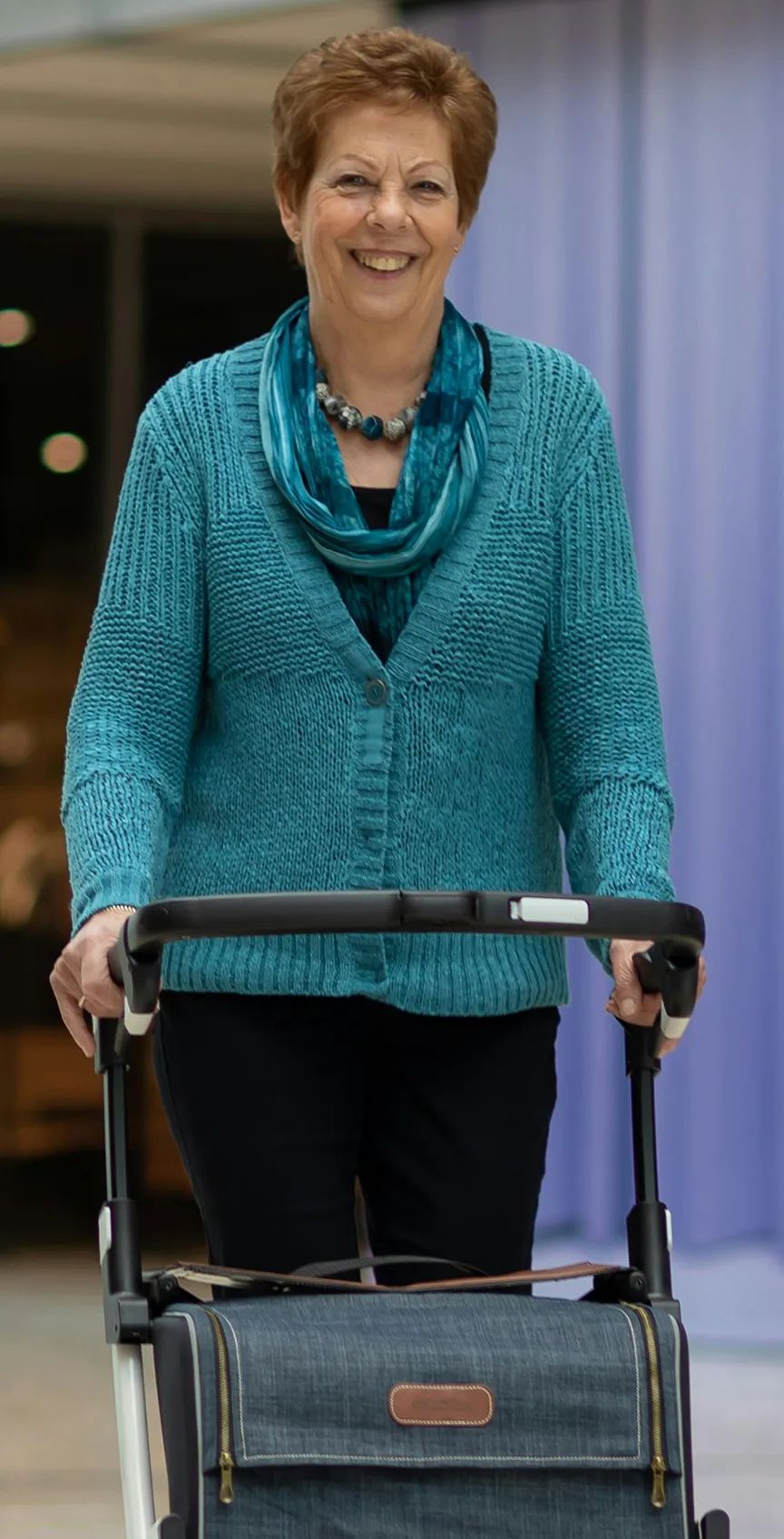 A senior smiling at the camera