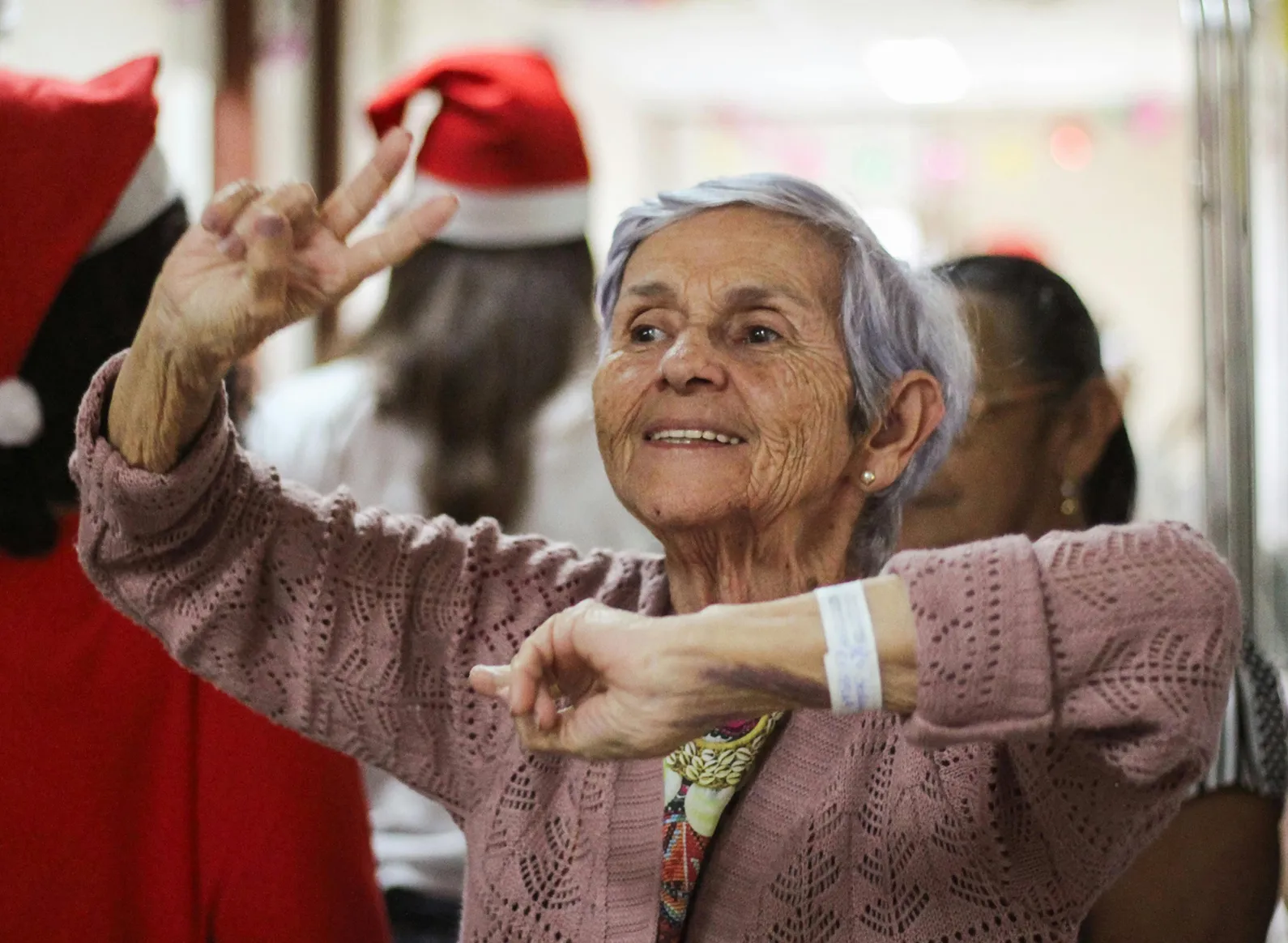 A senior smiling and dancing